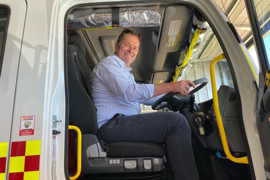 Liberal MP for Chaffey, Tim Whetstone, at the wheel of a CFS truck.