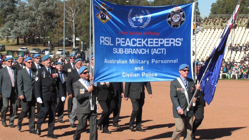 Peacekeepers march in the National Ceremony to commemorate Anzac Day.