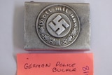 A badge with a swastika on it