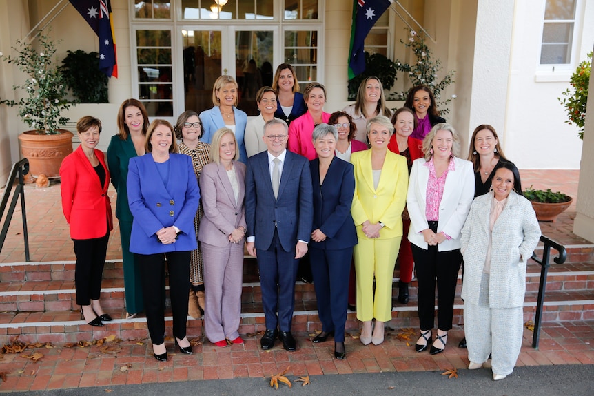 Anthony Albanese standing on the steps of government house with the women in the ministry after the swearing in ceremony
