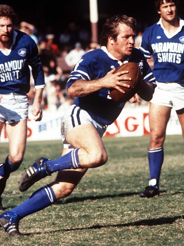 A man in the 1970s plays rugby league