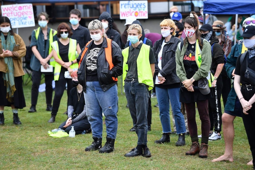 Protesters are seen during a rally in support of asylum seekers detained at the Kangaroo Point Central Hotel in Brisbane.