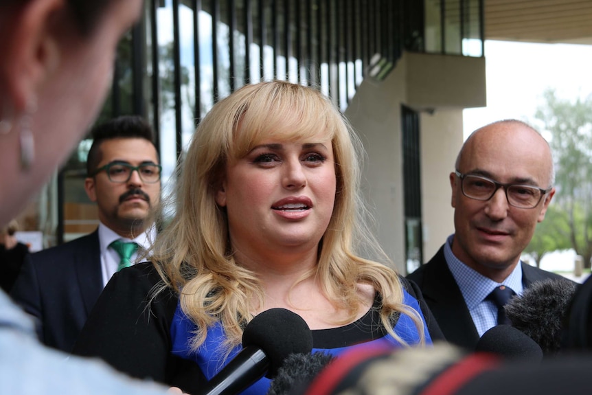 Rebel Wilson speaks to the media outside the High Court.