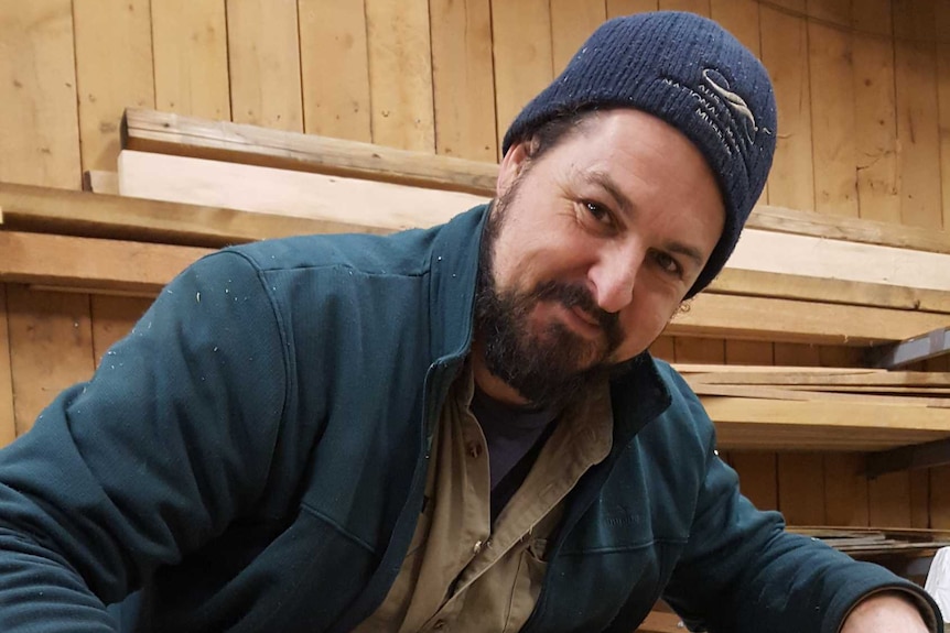 Cody Horgan building a wooden boat.