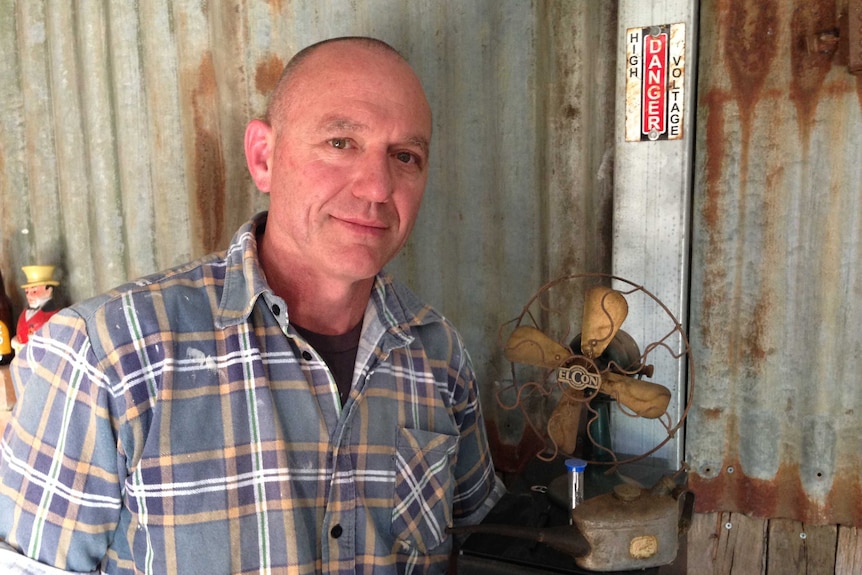 Hazelwood worker Greg Dunn standing in front of a corrugated iron wall in Churchill