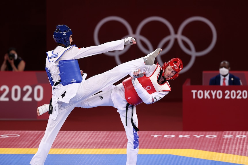 Jack Marton ducks under a kick from his opponent