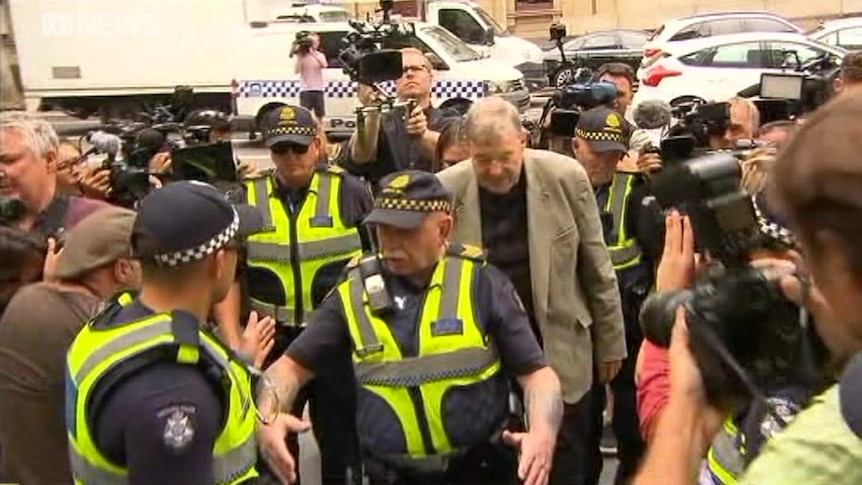 Cardinal George Pell arrives at court