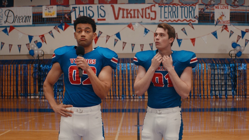 A pep rally in the film Bottoms.