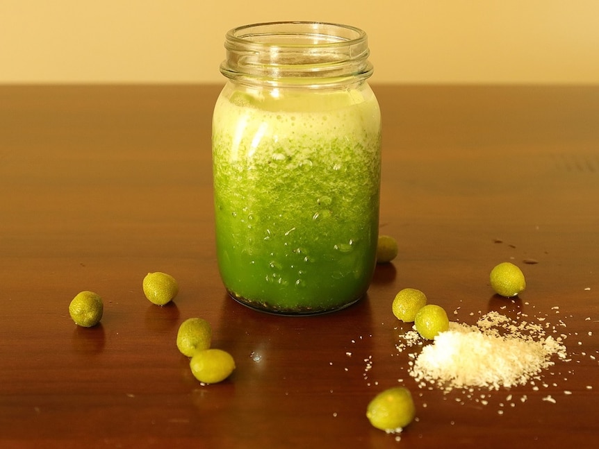 A desert lime smoothie in a glass on a table.