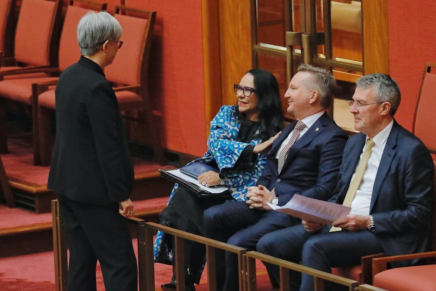 Penny Wong speaks to Linda Burney, Chris Bowen and Mark Dreyfus in the Senate