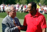 Tiger Woods is congratulated by Jack Nicklaus.