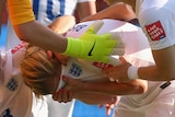 Laura Bassett is consoled by teammates after own goal