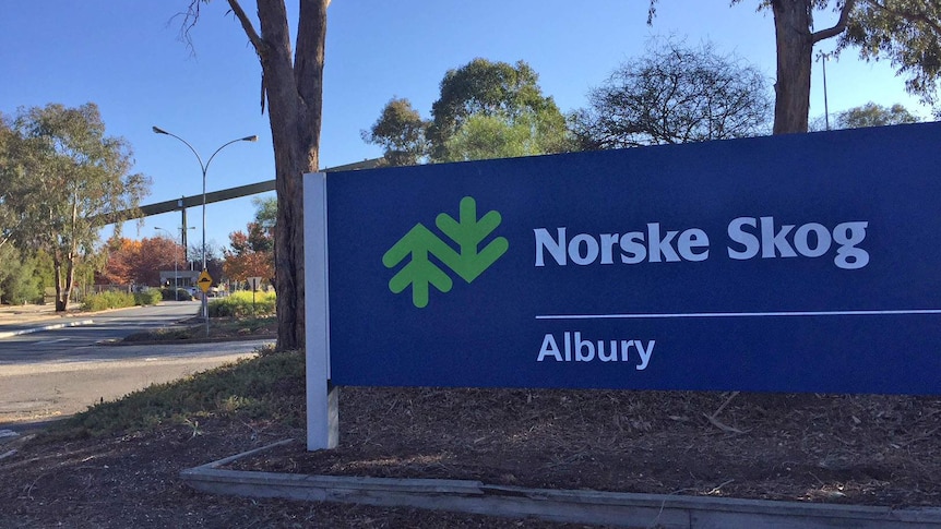A blue sign displays the words 'Norske Skog Albury' next to a road.