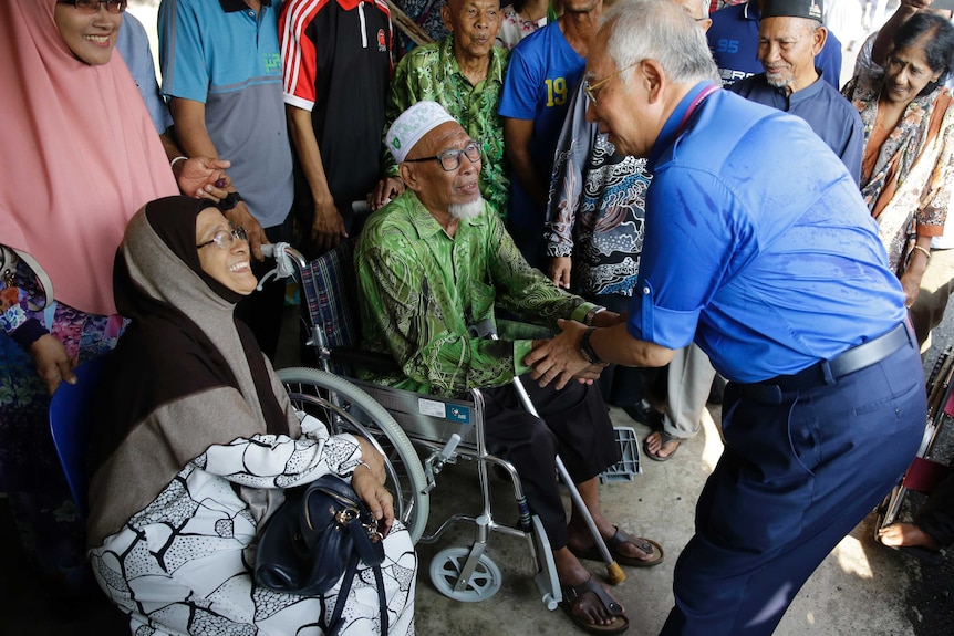 Malaysian Prime Minister Najib Razak greets residents.