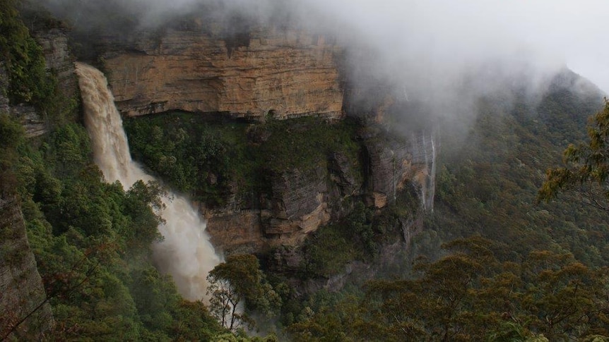 A waterfall flows heavily in the Blue Mountains
