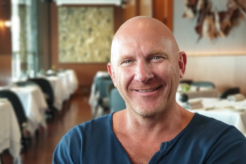 Matt Moran sits in a restaurant