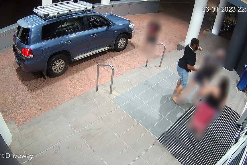 A CCTV still showing the one-punch assault outside the front doors of a hotel.