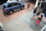 A CCTV still showing the one-punch assault outside the front doors of a hotel.