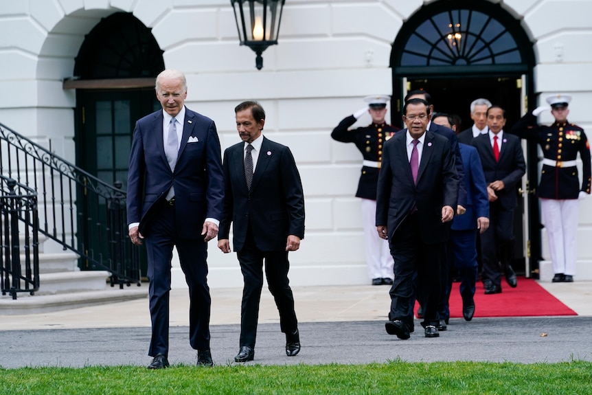 President Joe Biden and leaders from ASEAN stand together for a group photo in front of the White House.