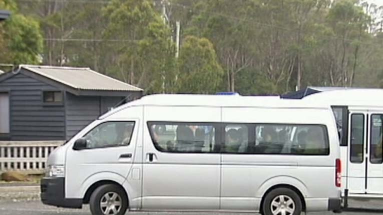 Tour bus parked at Cradle Mountain, Tasmania.