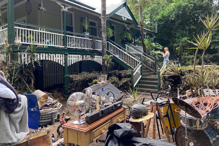 Belongings on the lawn outside a family home.