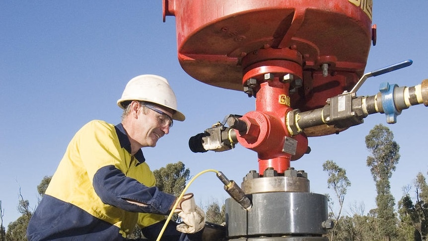 A miner works on a coal seam gas bore hole near Narrabri.