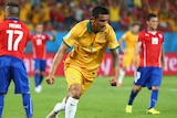Tim Cahill celebrates scoring for Australia against Chile at the World Cup in Brazil.