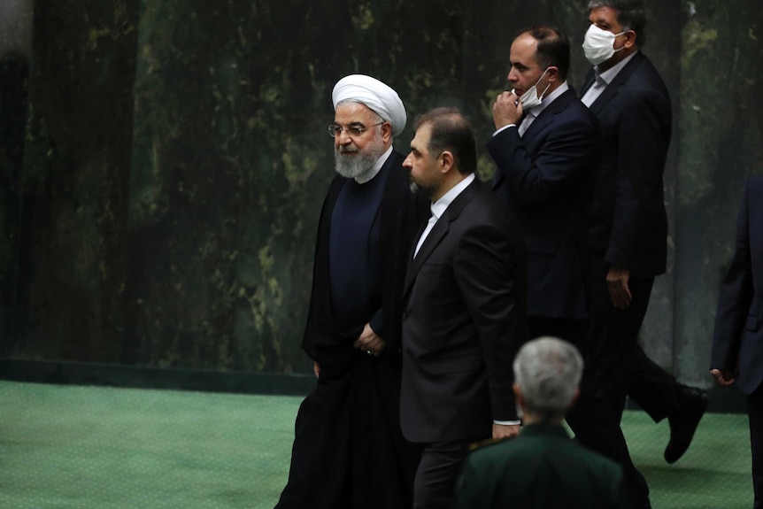 Iranian President Hassan Rouhani enters parliament.