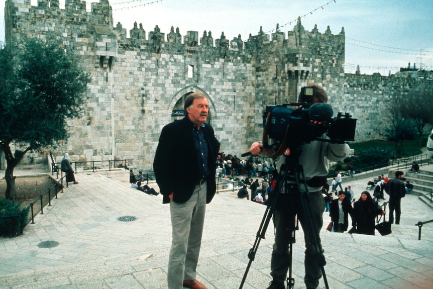 George Negus in front of the camera.