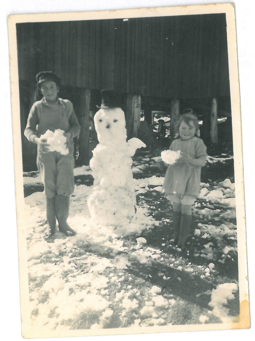 From left, Bob Bratton and Beth Bratton with a snowman in Waddamana