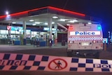 Police at a Caboolture service station where a man walked into with a stab wound to the abdomen