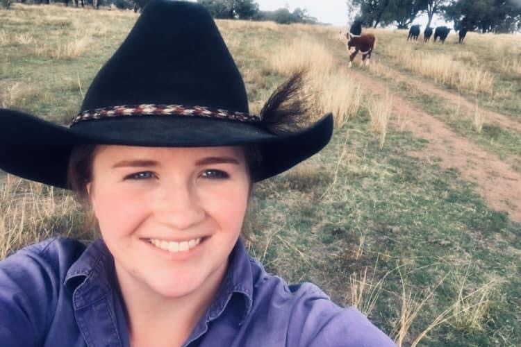 Young woman takes selfie on her farm.