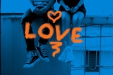 A photo of a young high school sweethearts sitting on a bench,  with the word love emblazoned across the image.