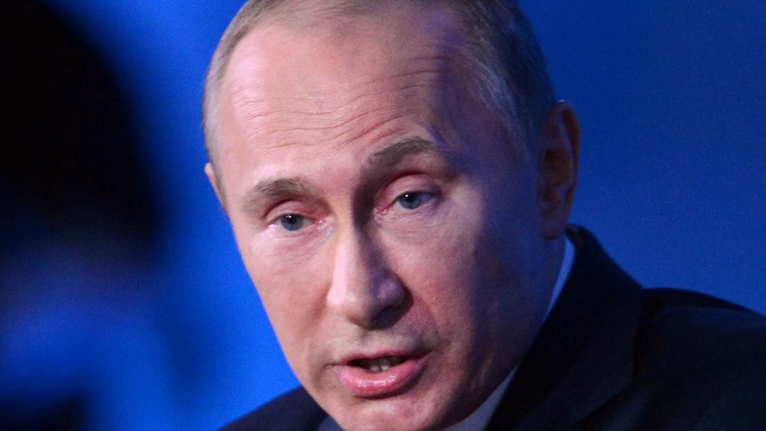 Vladimir Putin backs plan to ban US adoptions at a media conference, December 20, 2012.