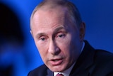 Vladimir Putin backs plan to ban US adoptions at a media conference, December 20, 2012.