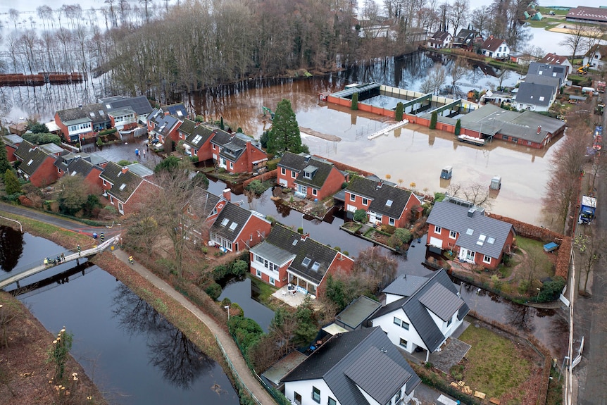 Houses are shown flooded in Lilenthal, Germany