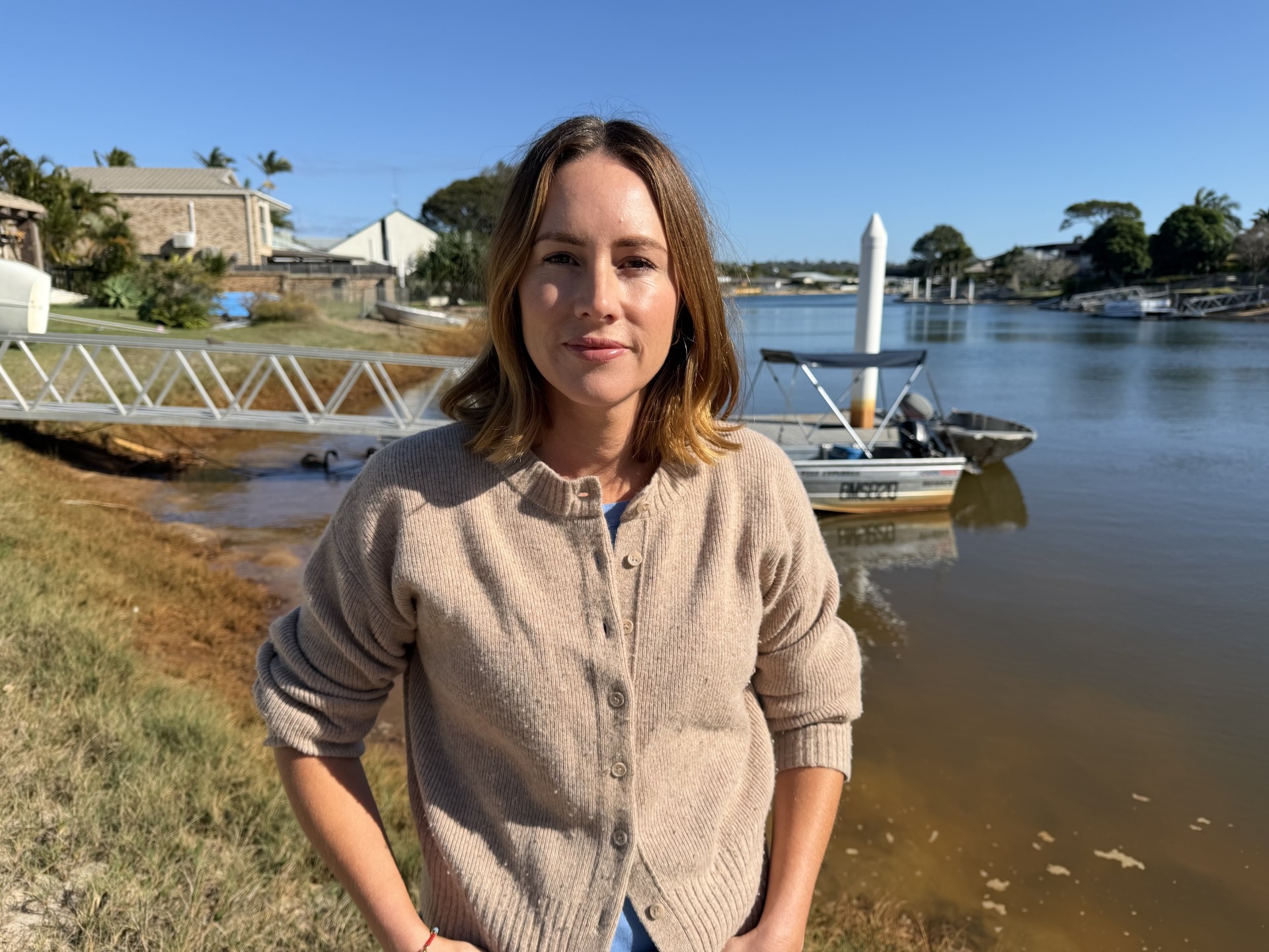 Queensland builder fined over rust-coloured canal pollution