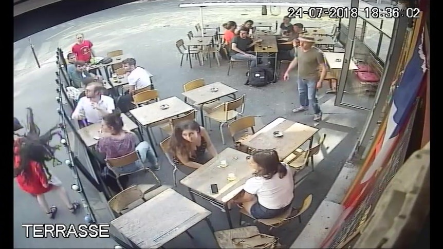 A woman is struck in the face by a stranger in Paris.