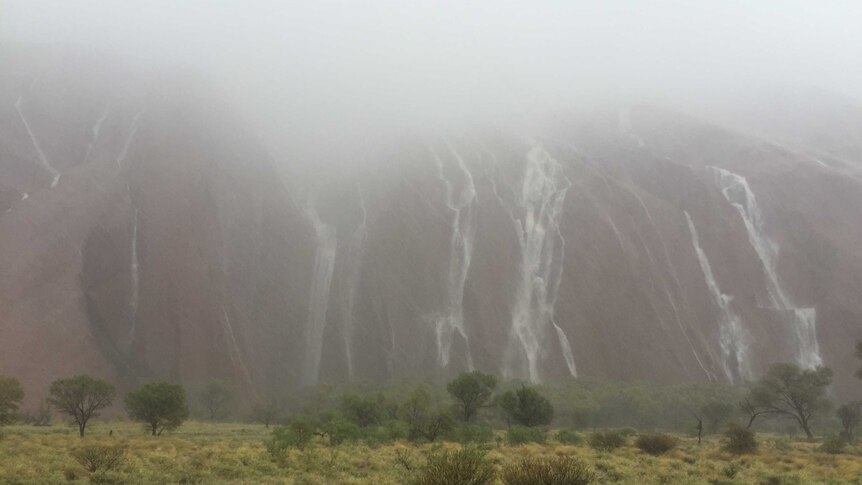 Flash flooding at Uluru has led to the closure of the national park.