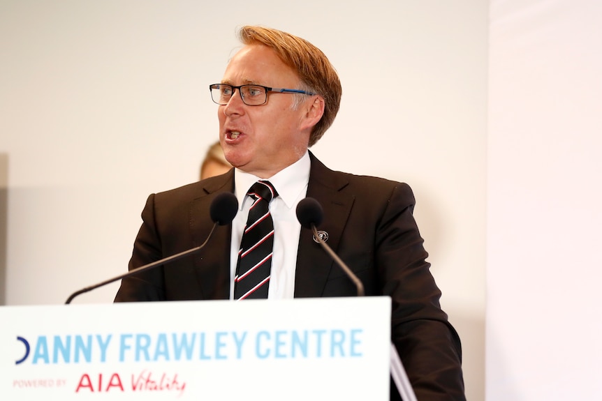 Matt Finnis speaks at a podium with Danny Frawley Centre written in front of the podium