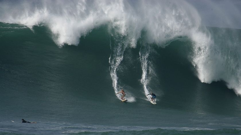 The Americans were surfing in massive waves of around 15 metres at Waimea Bay.