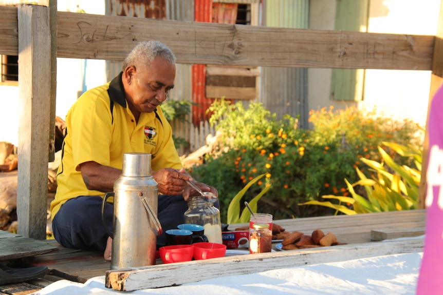 Ratu Paula sitting down making a brew.