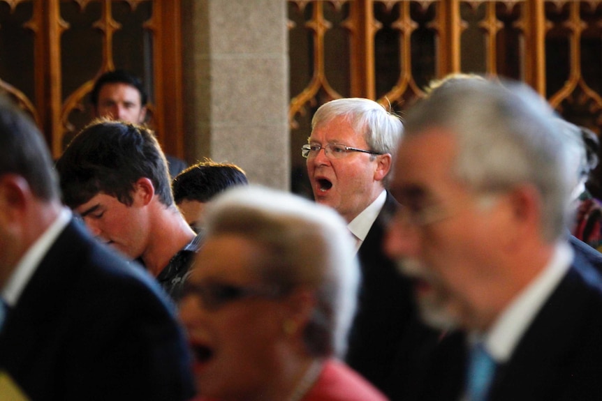 Kevin Rudd sings during church service.