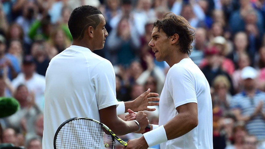 Australia's Nick Kyrgios (L) shakes hands with Spain's Rafael Nadal at Wimbledon in July 2014.