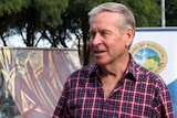 Headshot of WA Premier Colin Barnett in Margaret River, with a skate park in the background.