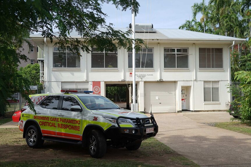 An ambulance 4WD is parked out the front of a white St Johns ambulance building.
