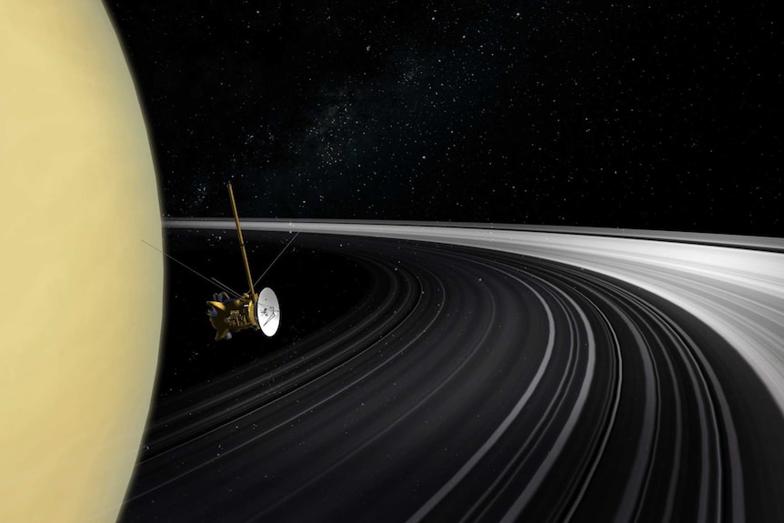 A spacecraft cruises next to Saturn's rings