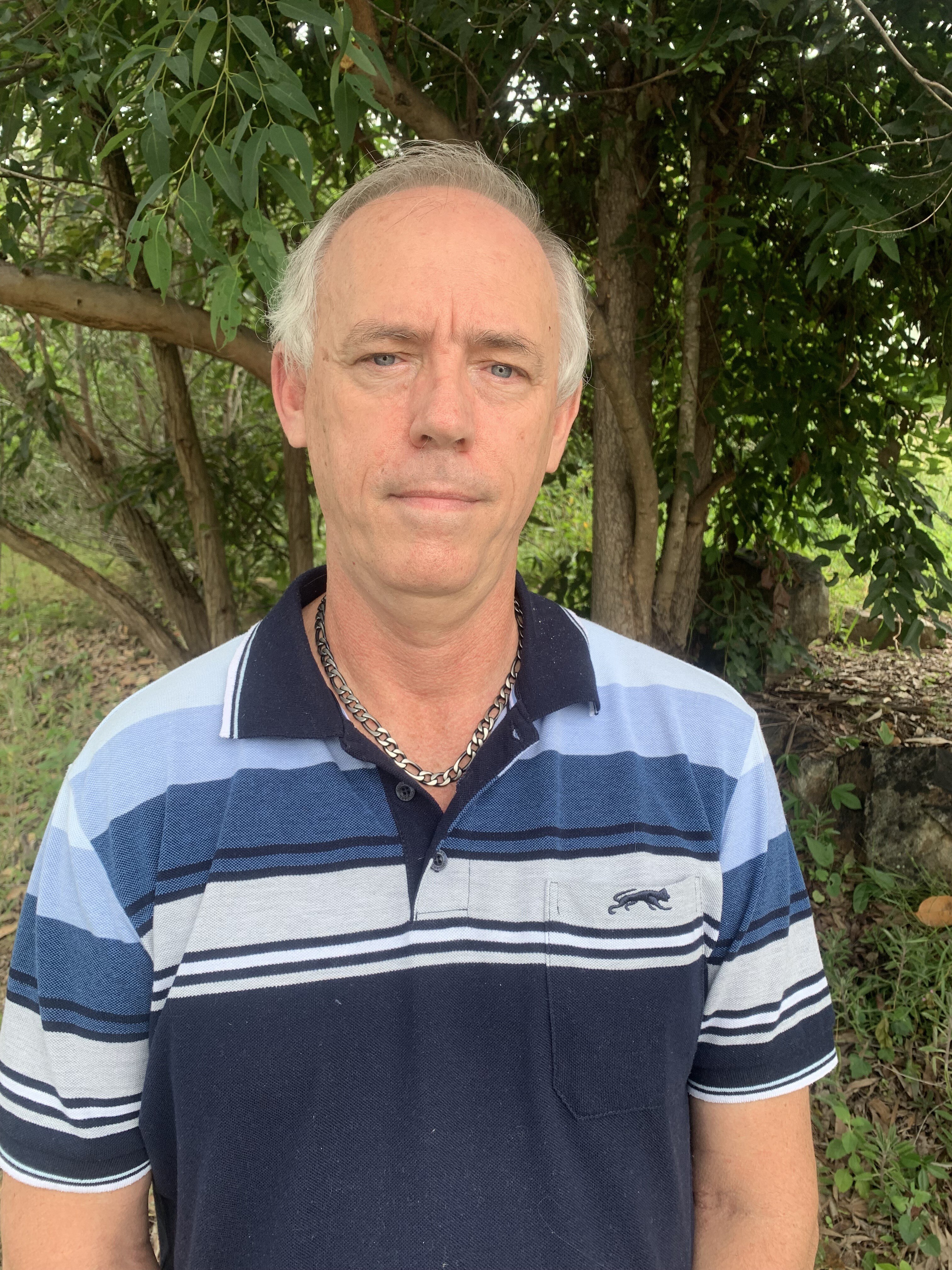 Jeffrey Addison wears a blue shirt.