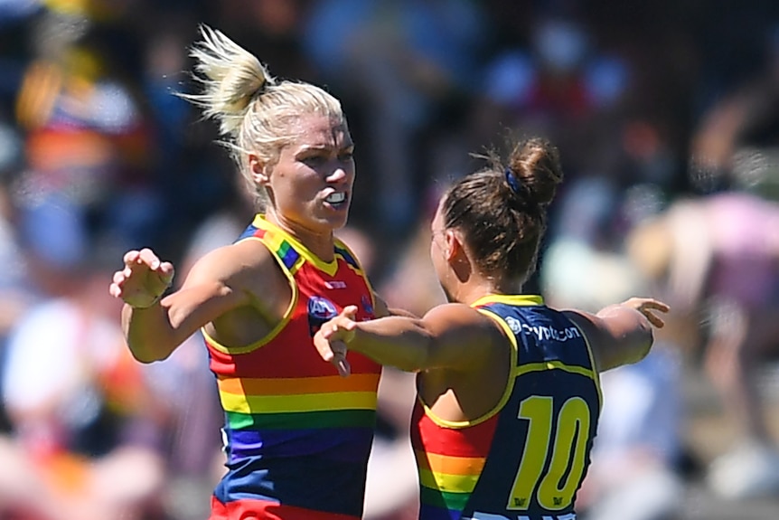 Adelaide Crows player Erin Phillips celebrates a goal with teammate Ebony Marinoff 
