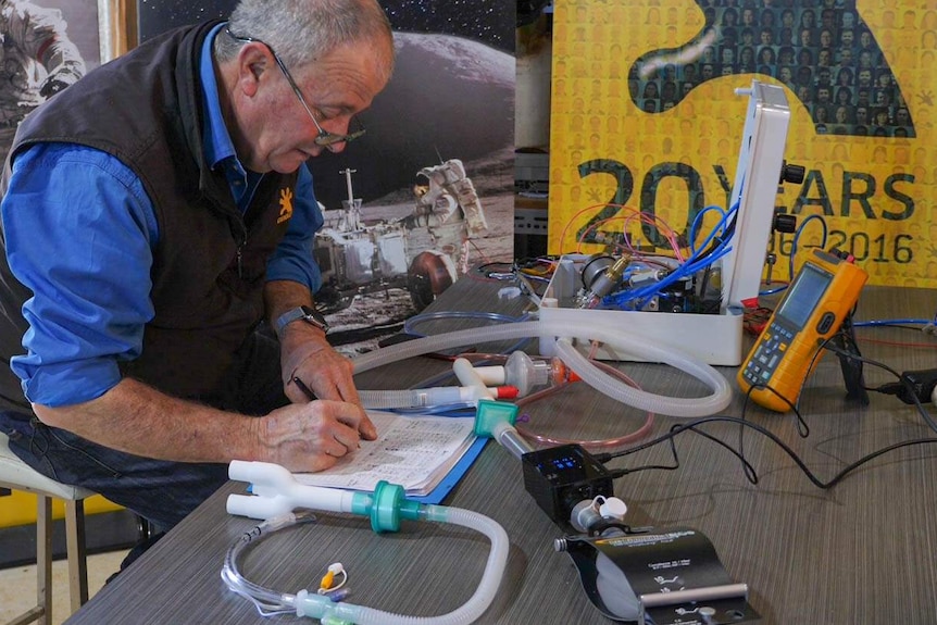 Gekko co-founder Sandy Gray assembling a ventilator in regional Victoria during the COVID-19 pandemic in 2020